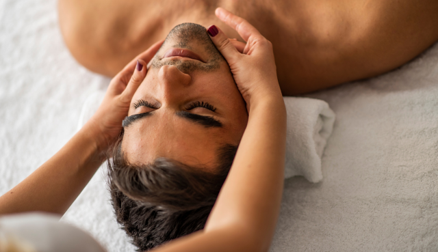 Male client recieving men's spa services at Flirt Cosmetics Studio